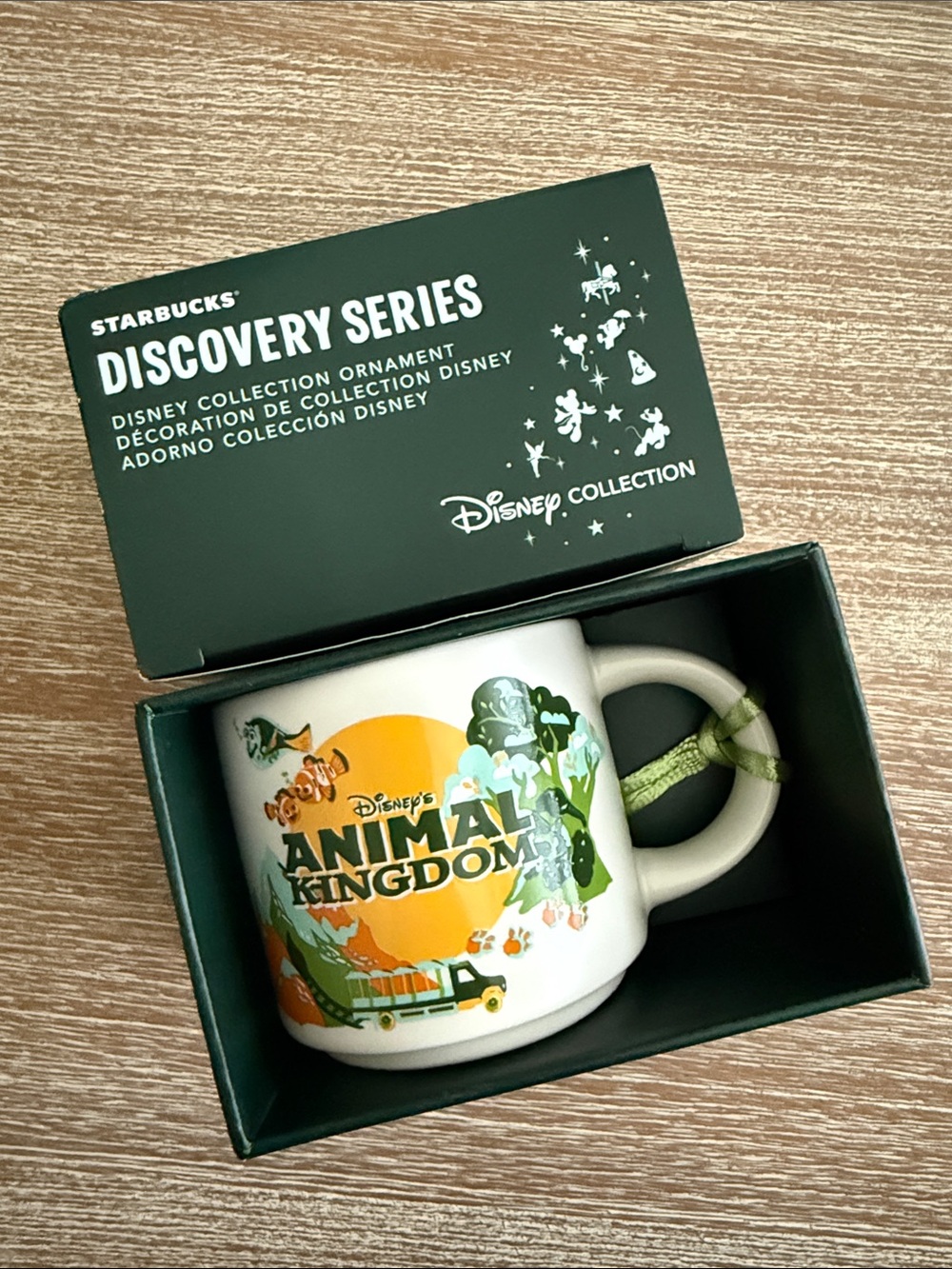 Starbucks White Mug with Green and Orange Animal Kingdom Graphics